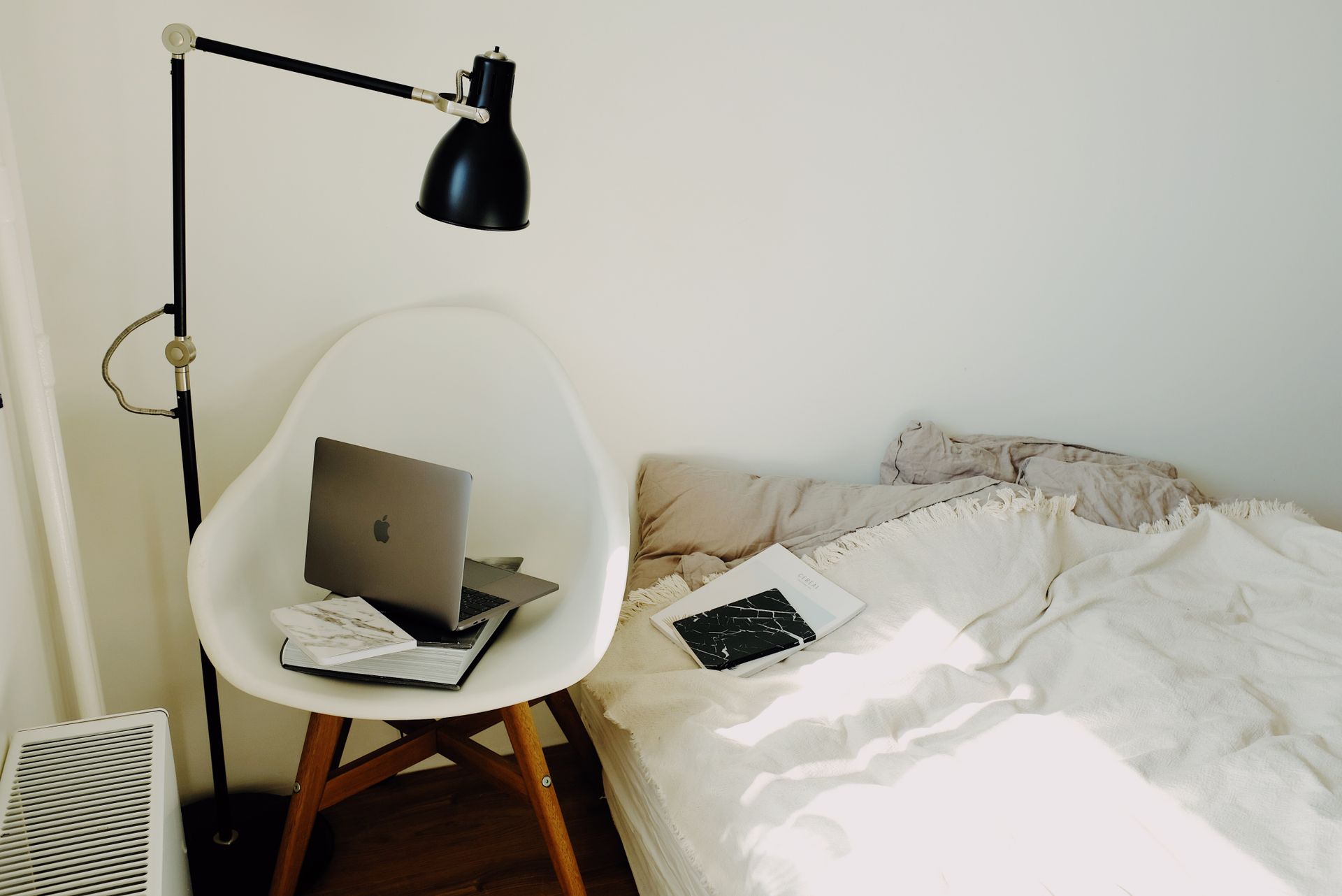 A calm modern workspace with soft natural light and a few thoughtfully placed objects.
