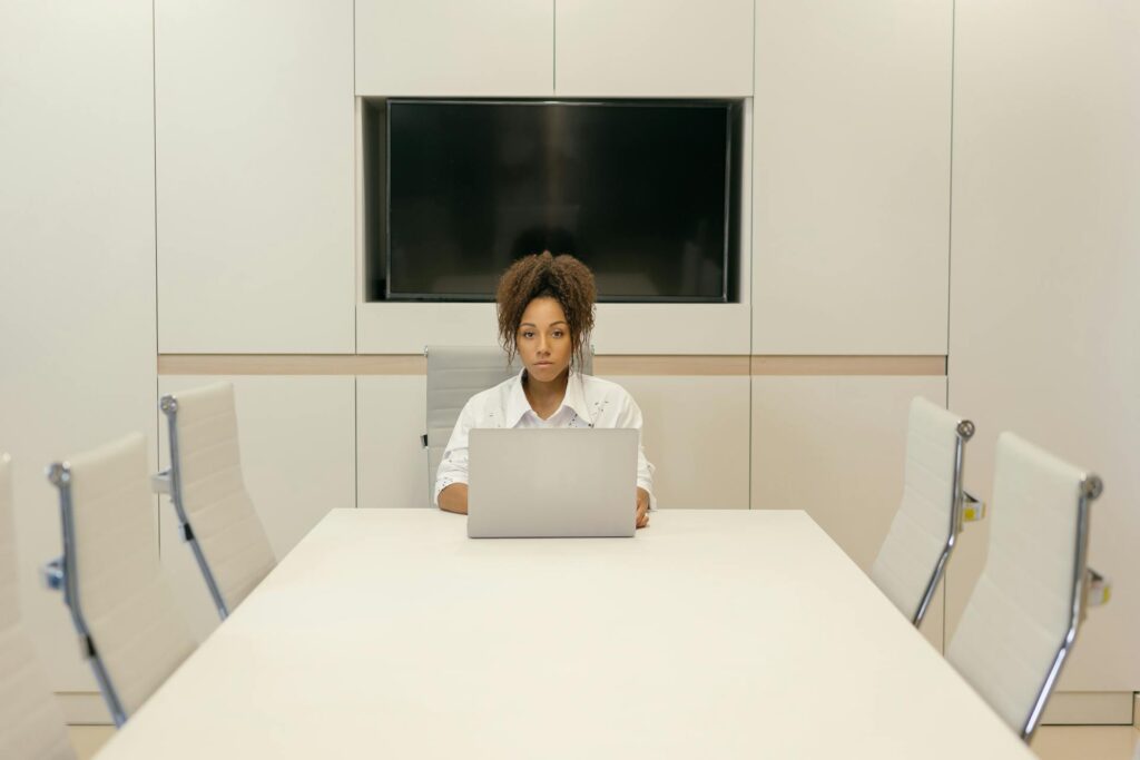 A single laptop on a clean desk in a quiet workspace, evoking single-task focus.